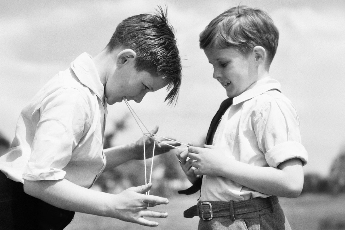 Boys playing Cat’s Cradle, c. 1930s