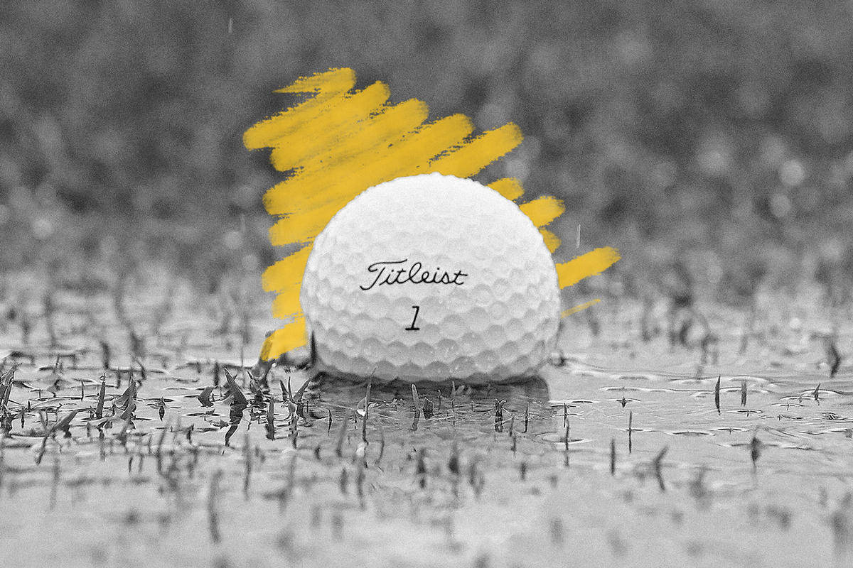 Golf ball in a rain puddle