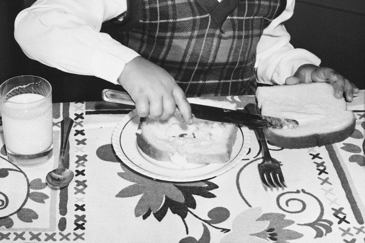Girl buttering toast, circa 1940s